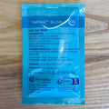 A blue SafAle S-04 dry ale yeast sachet by Fermentis on a light wood background.