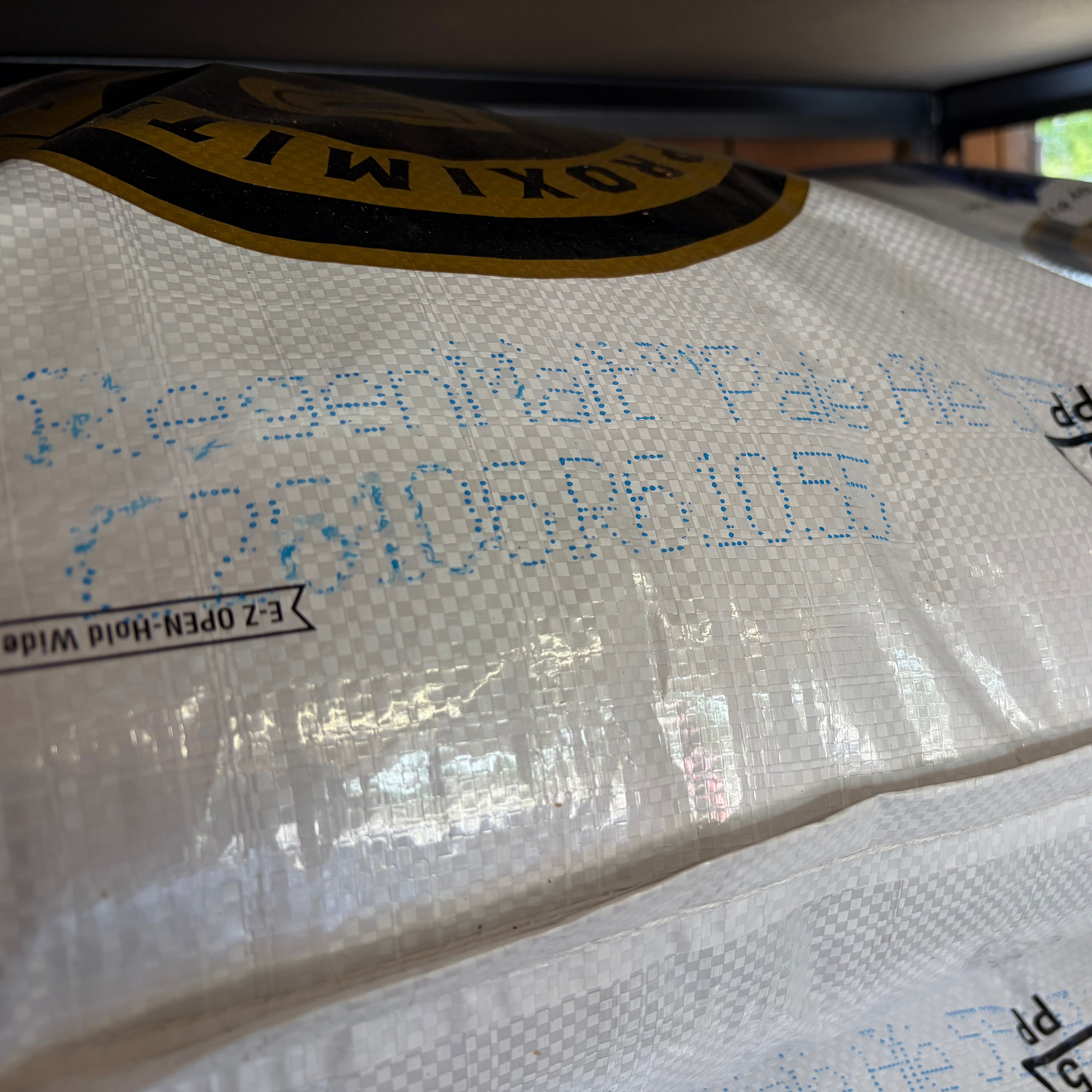 A close up of a sack of proximity regenmalt pale ale malted barley showing the bag label