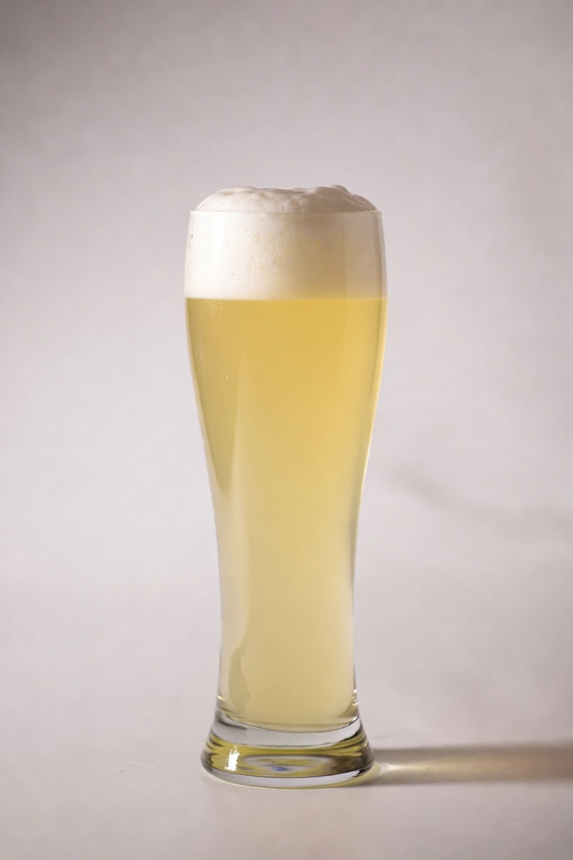 glass of pale golden beer showing 3 srm color from proximity organic malted wheat specialty malt