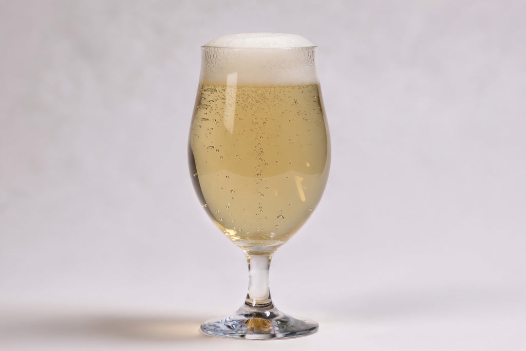 a glass of pale beer in a tulip glass showing 2 srm with proximity regenmalt pilsen