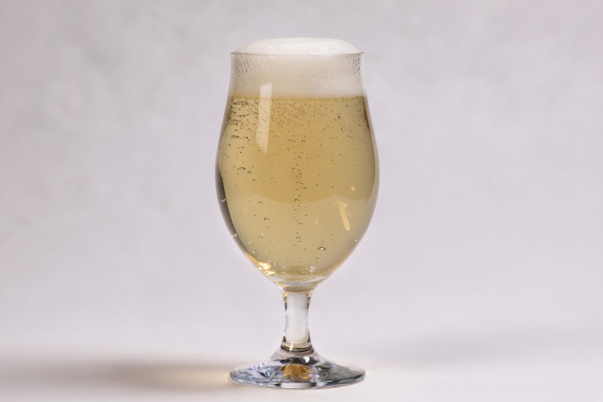 a glass of pale beer in a tulip glass showing 2 srm with proximity regenmalt pilsen