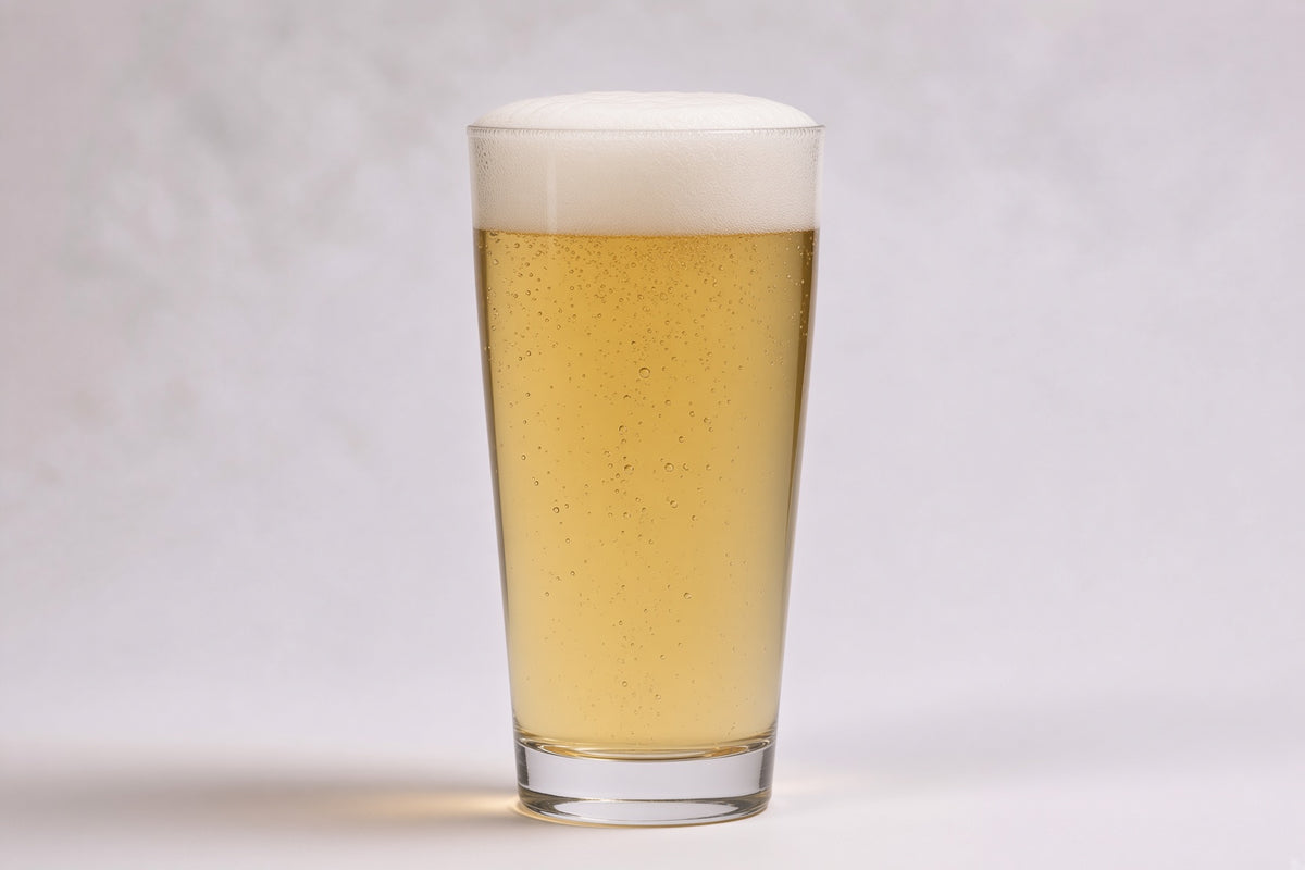 a pint glass of pale beer showing 2 srm color with a white head made with root shoot pilsner malted barley