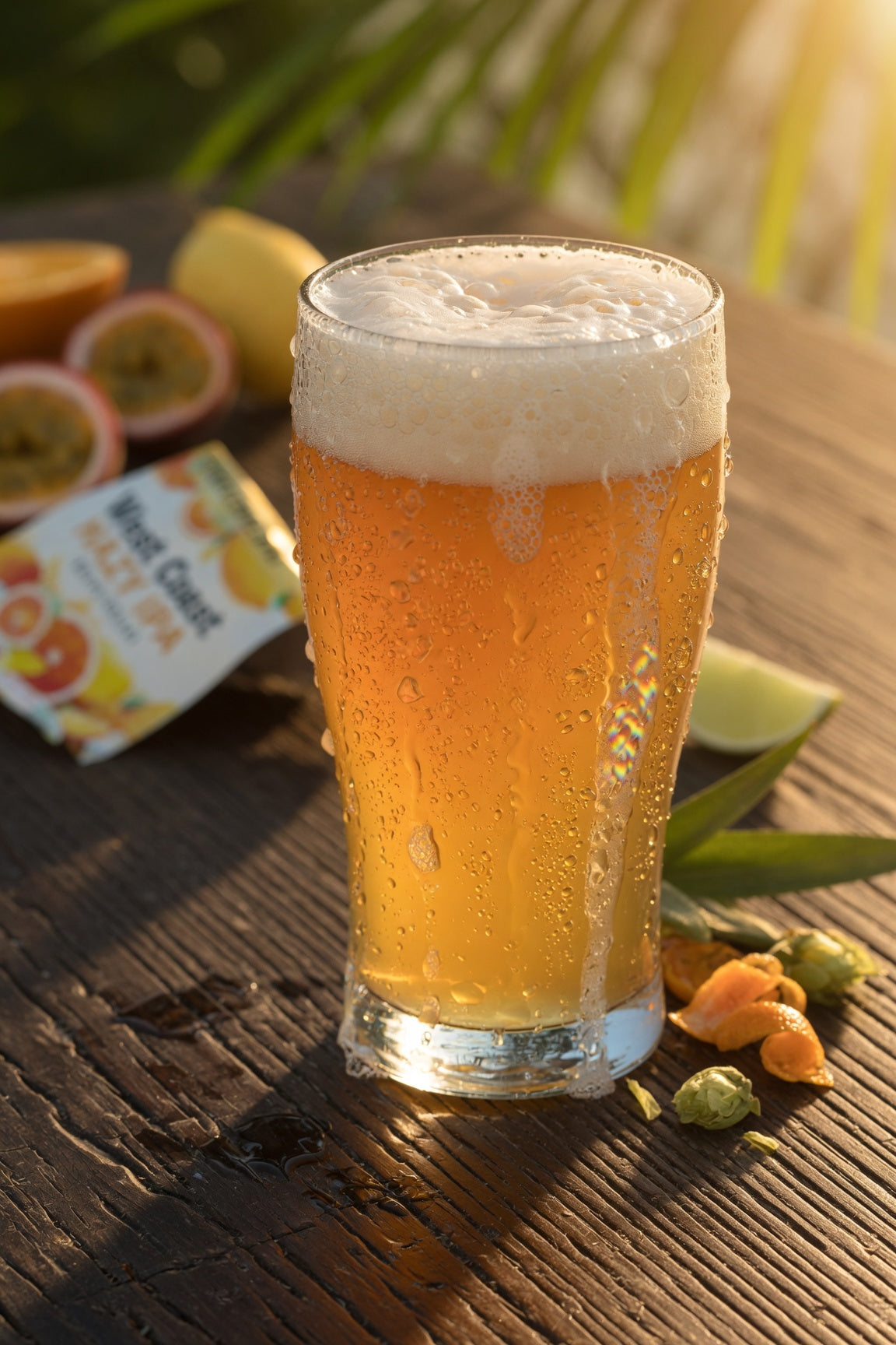 moody light shot of a pint of pale ale on a table in a tropical beach setting with simcoe hops