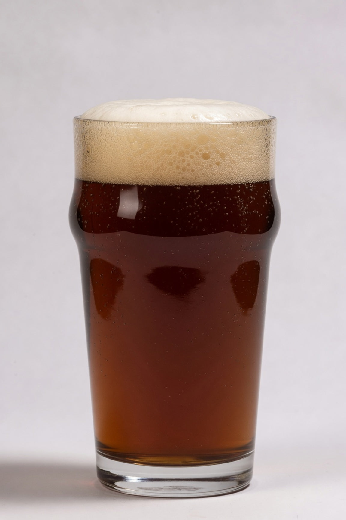 glass of deep amber brown beer showing 26 srm color from simpsons amber specialty malt