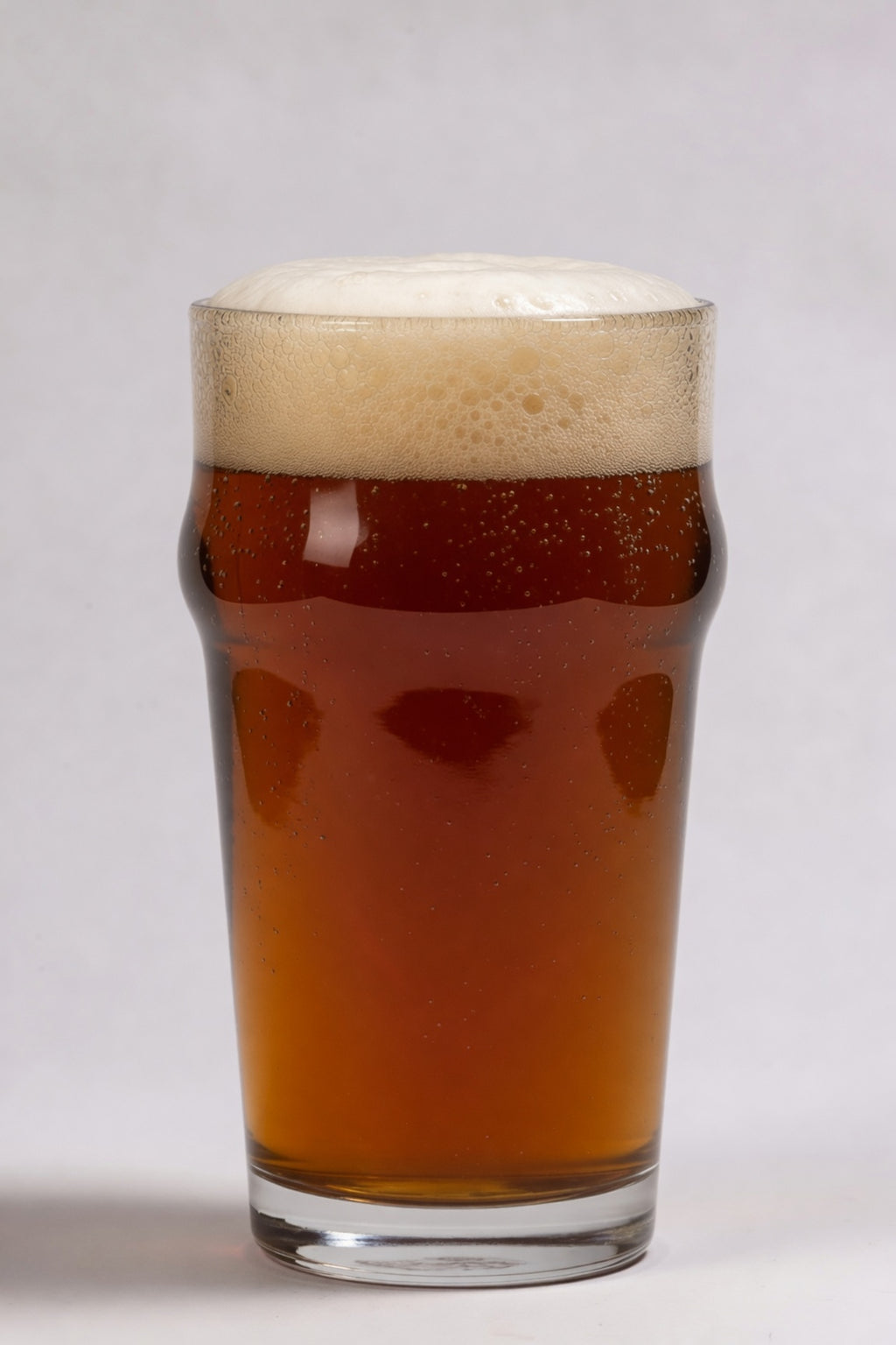 glass of deep amber beer showing 23 srm color from weyermann melanoidin specialty malt