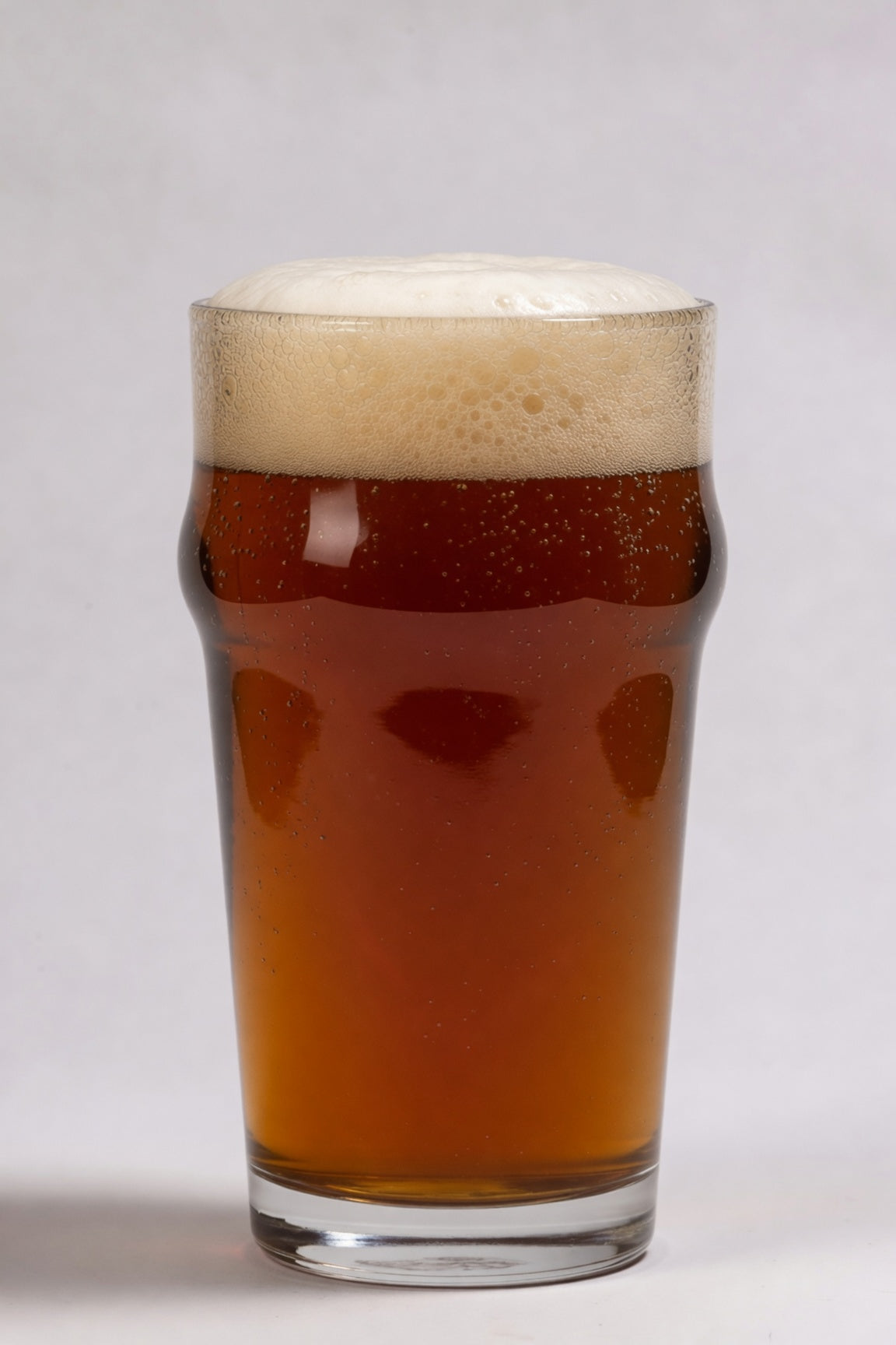 glass of deep amber beer showing 23 srm color from weyermann melanoidin specialty malt