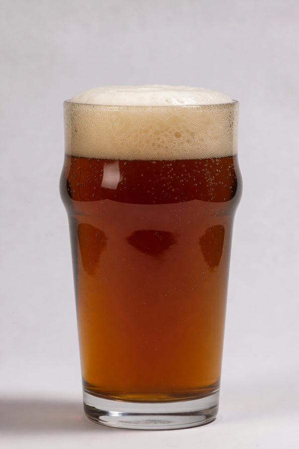 glass of deep amber beer showing 23 srm color from weyermann melanoidin specialty malt